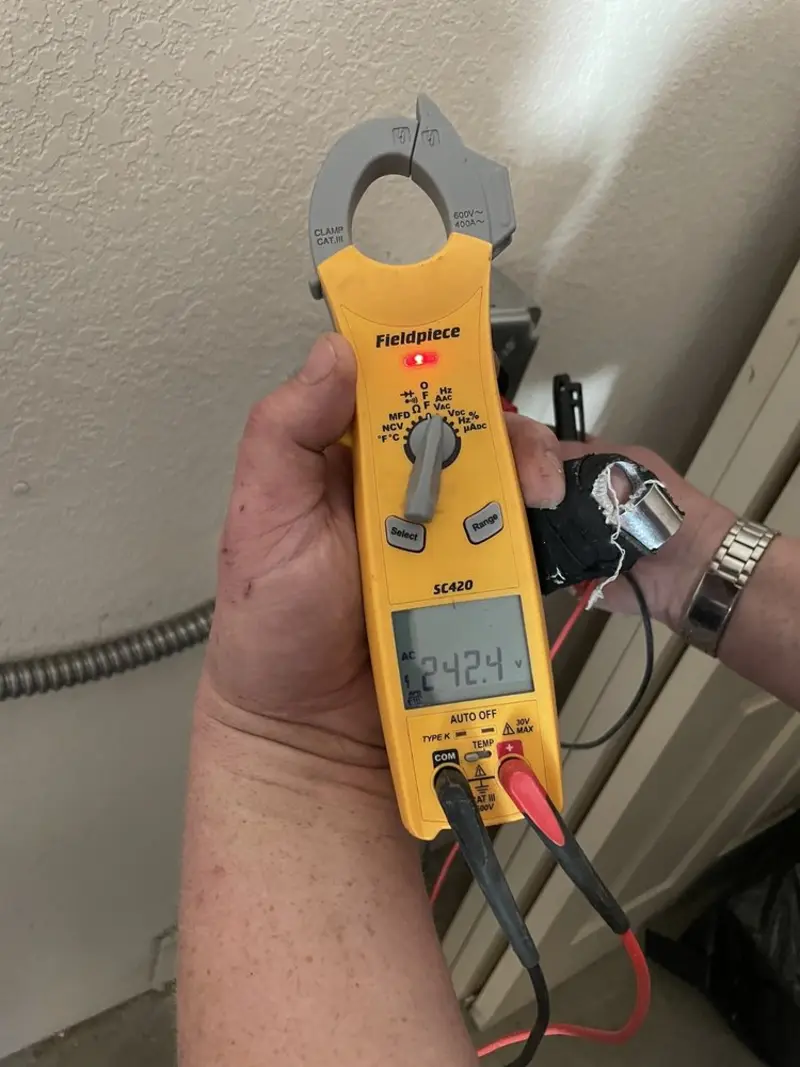 Voltage testing with clamp meter during Outlet Installation in Lake Lakengren